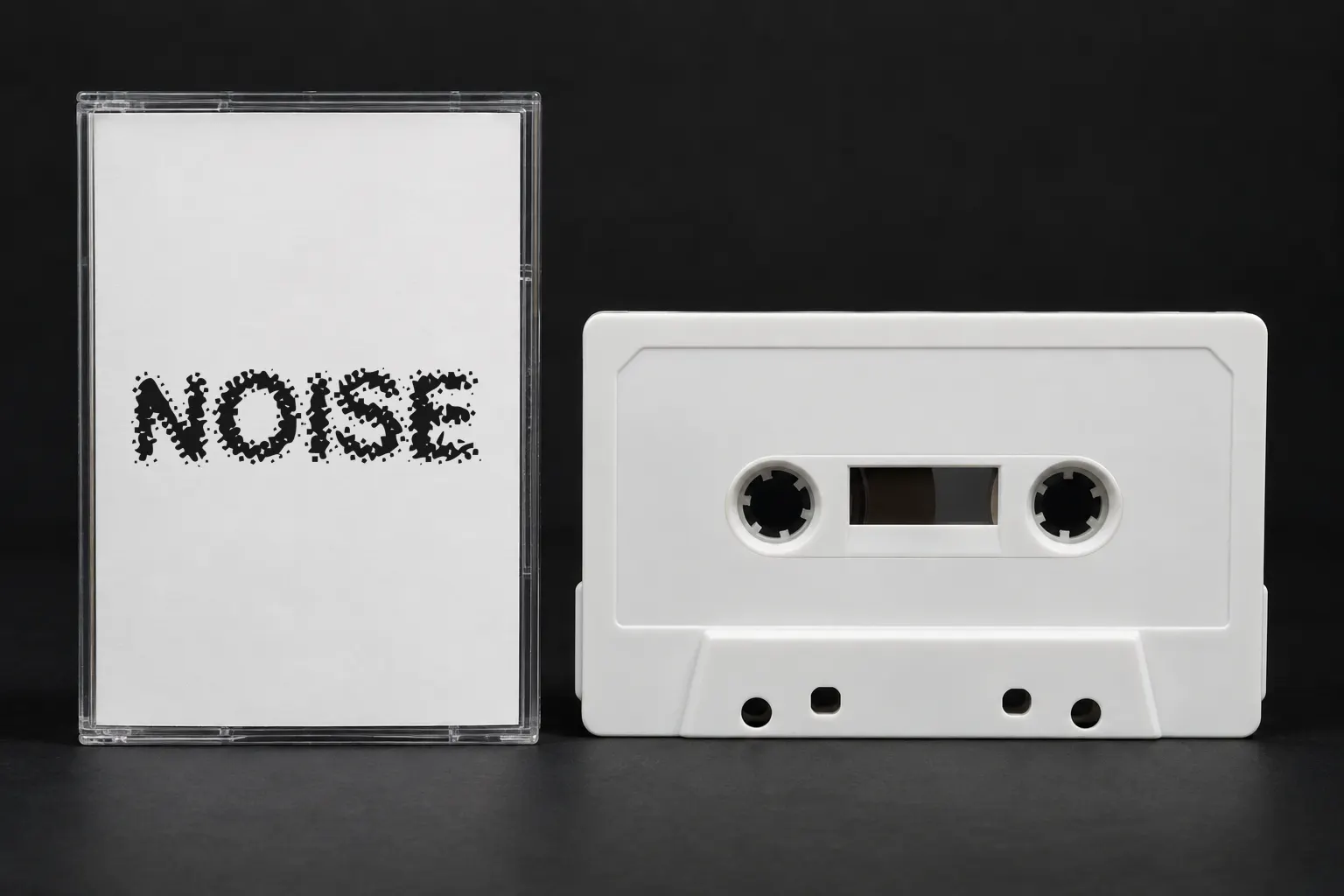 Acidic font on a cassette tape insert reading NOISE