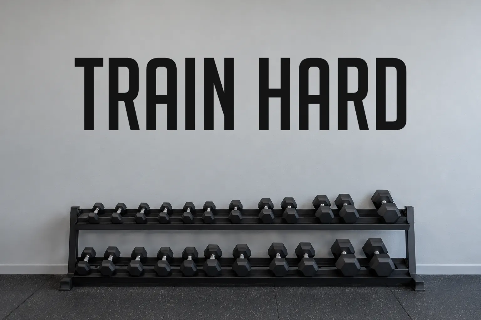 Big Noodle Titling font on a gym wall reading TRAIN HARD