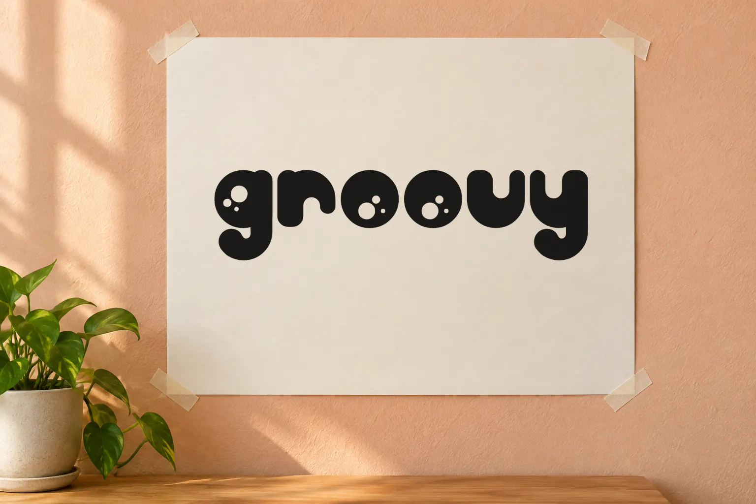 Billo font on a paper poster reading groovy