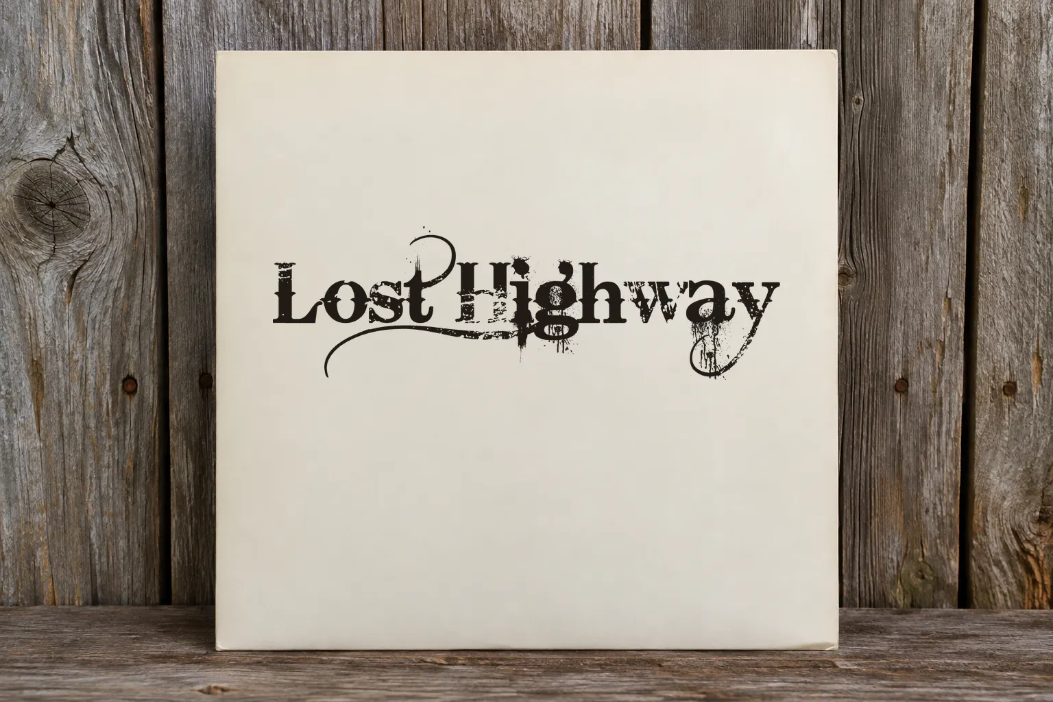 Bleeding Cowboys font on a record sleeve reading Lost Highway