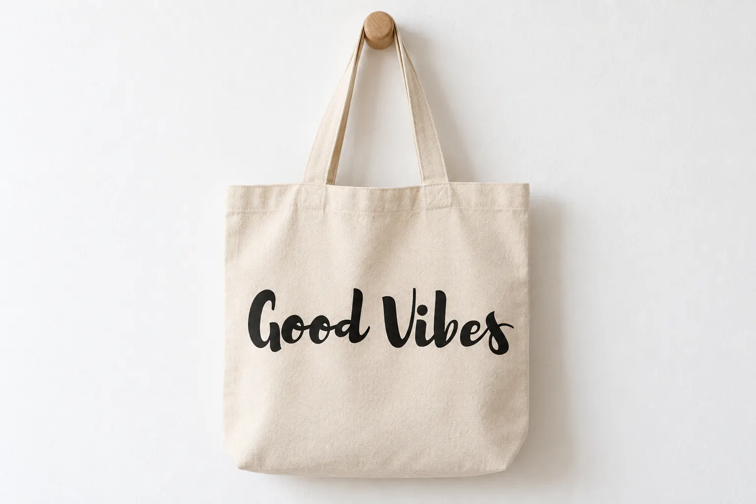 Brusher font on a canvas tote bag reading Good Vibes