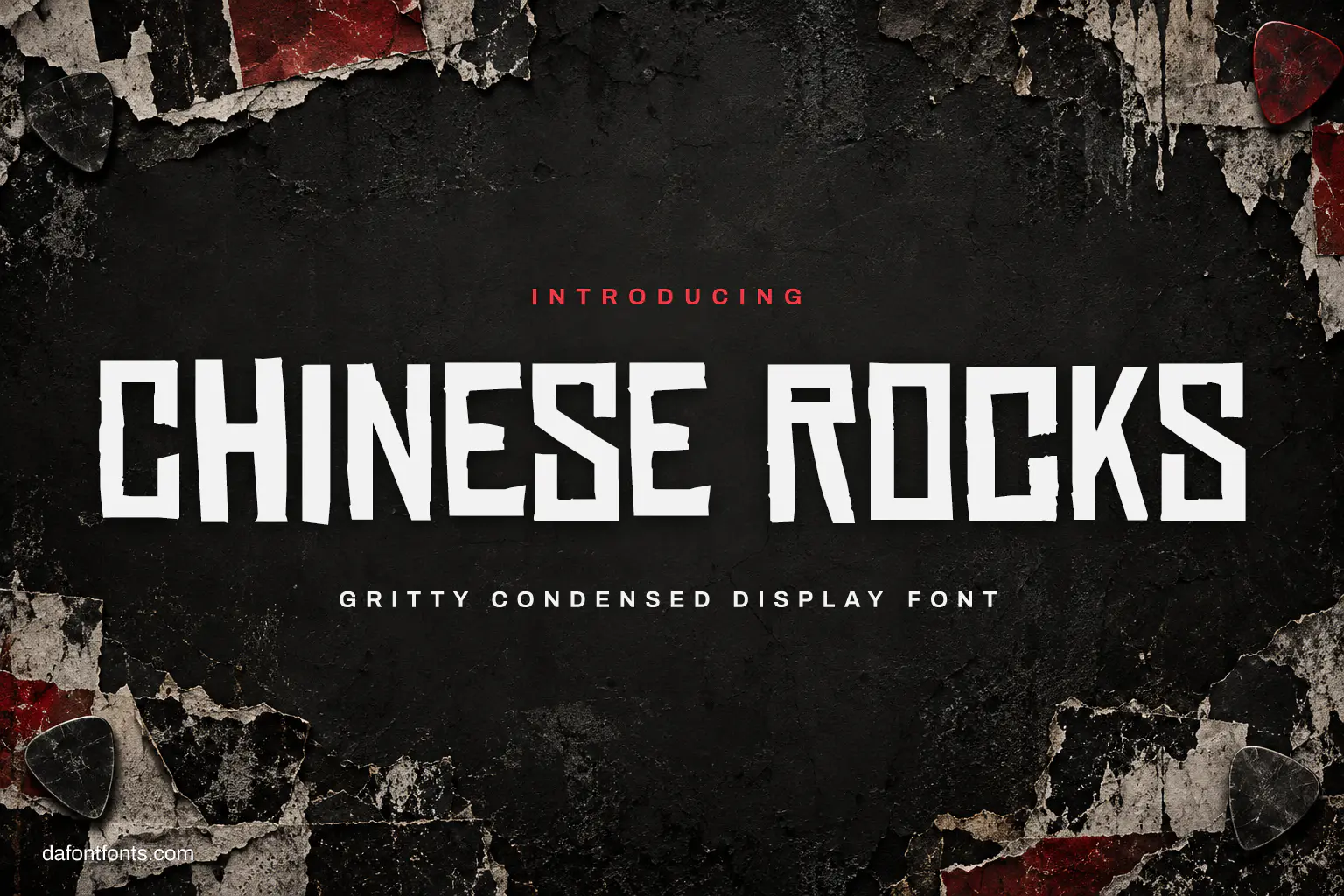 Chinese Rocks font poster: white gritty caps on a charcoal wall with torn posters
