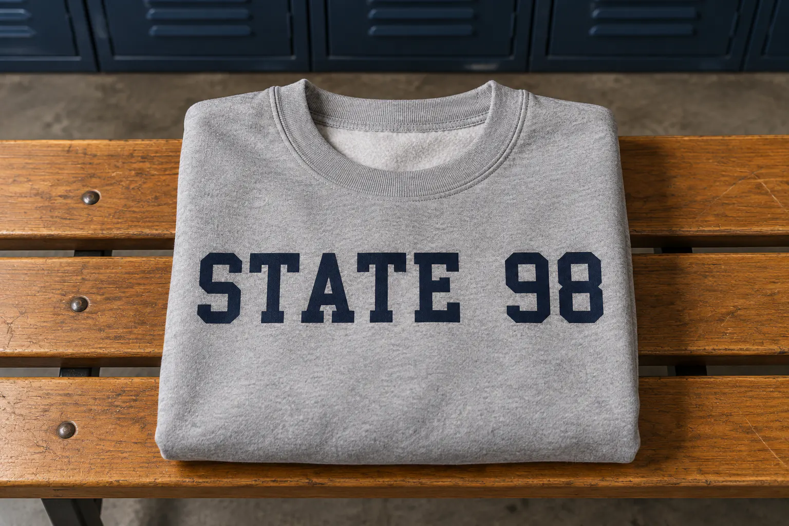 College font on a grey sweatshirt reading STATE 98
