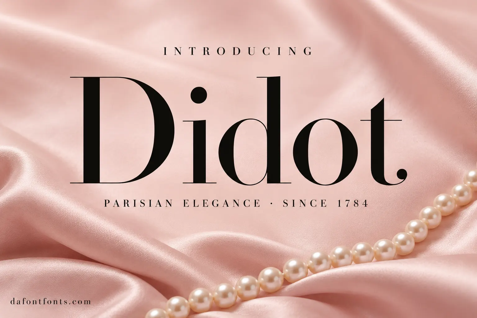 Didot font poster: black Didot headline on blush pink satin with a pearl necklace