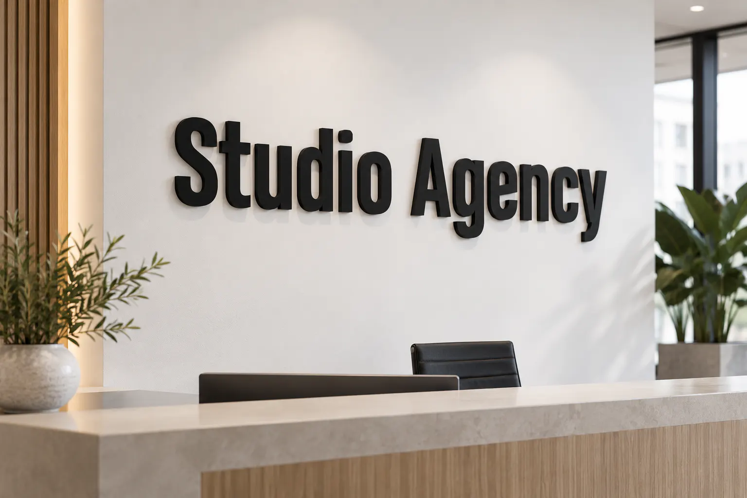Heading Pro font on an office reception wall reading Studio Agency