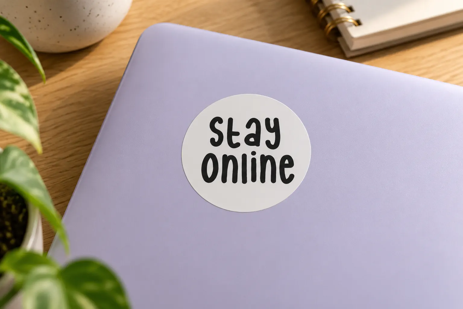 Internet Friends font on a laptop sticker reading Stay Online