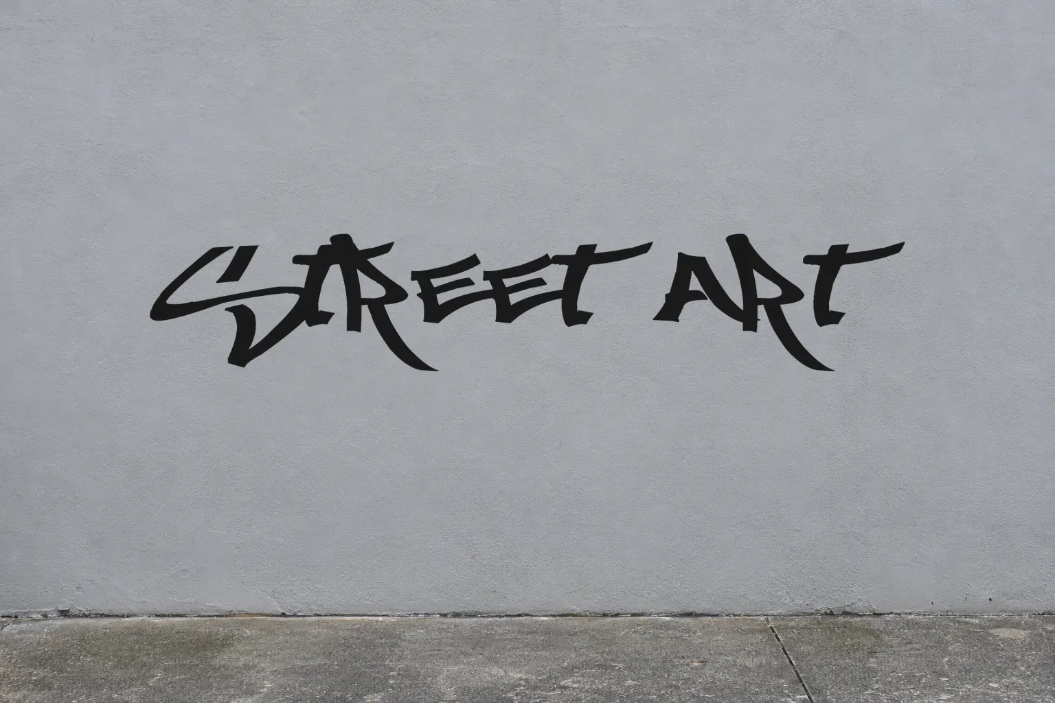 Mostwasted font on a concrete wall reading Street Art